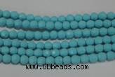 CTU1220 15.5 inches 4mm faceted round synthetic turquoise beads
